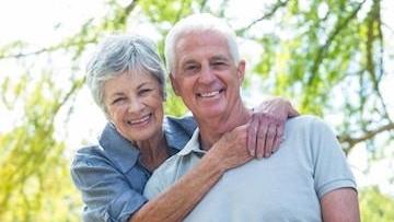 older woman smiling with older man